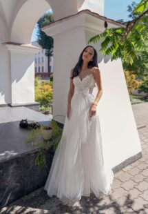 Style #15021, A-line wedding dress with illusion sweetheart neckline and lace embroidery; available in ivory