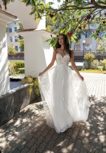 Style #15021, A-line wedding dress with illusion sweetheart neckline and lace embroidery; available in ivory