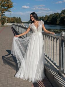 V-neck A-line wedding dress with cap sleeves and open back