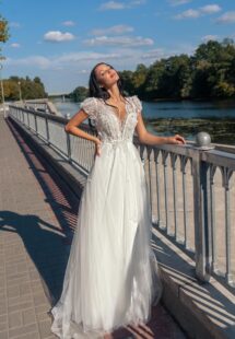 Style #15022, V-neck A-line wedding dress with cap sleeves and open back; available in ivory