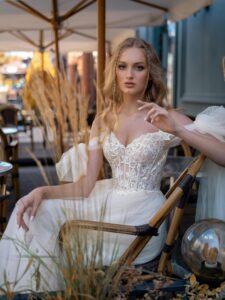 Cream off-the-shoulder A-line wedding dress with lace top