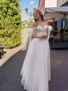 Cream off-the-shoulder A-line wedding dress with lace top