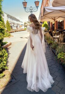 Style #15023, off-the-shoulder A-line wedding dress with lace top; available in cream