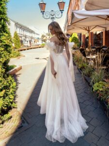 Cream off-the-shoulder A-line wedding dress with lace top