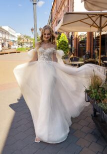 Style #15023, off-the-shoulder A-line wedding dress with lace top; available in cream