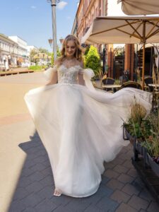 Cream off-the-shoulder A-line wedding dress with lace top