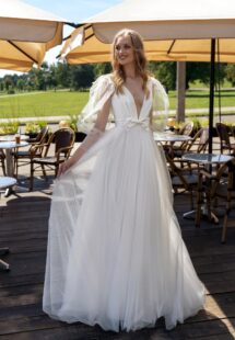 Style #15024, V-neck ball gown wedding dress with long balloon sleeves; available in ivory