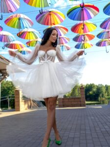Short wedding dress with a puffy skirt and long sleeves
