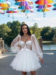 Short wedding dress with a puffy skirt and long sleeves