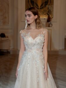 A-line wedding dress with 3D floral decor; available in peach, cream