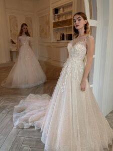 A-line wedding dress with 3D floral decor; available in peach, cream
