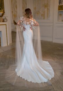 Style #2402L, strapless fit and flare wedding dress with detachable floral cape; available in ivory
