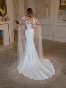 Strapless fit and flare wedding dress with detachable floral cape