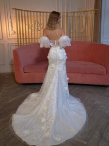 Strapless fit and flare wedding dress with long off-the-shoulder sleeves