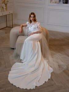 Strapless fit and flare wedding dress with detachable floral cape