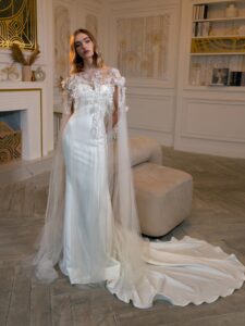 Strapless fit and flare wedding dress with detachable floral cape