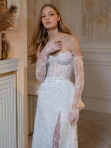 Beaded sheath wedding gown with detachable long sleeves and accent bow