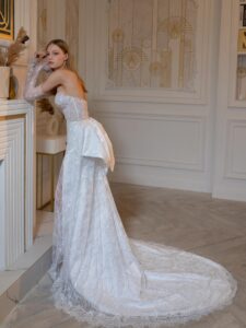 Beaded sheath wedding gown with detachable long sleeves and accent bow