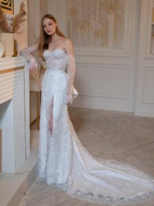 Beaded sheath wedding gown with detachable long sleeves and accent bow