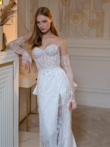 Beaded sheath wedding gown with detachable long sleeves and accent bow