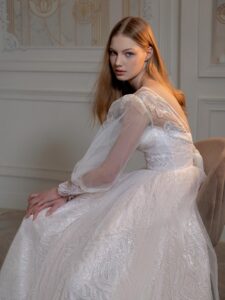 Sequinned A-line wedding dress with detachable long-sleeved overlay blouse; available in peach, ivory