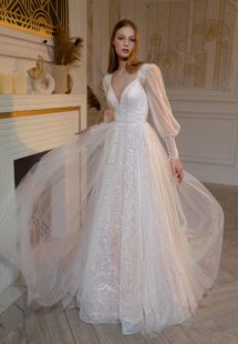 Style #2406L, sequinned A-line wedding dress with detachable long-sleeved overlay blouse; available in peach, ivory