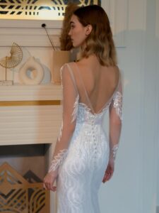 Beaded fit and flare wedding dress with long sleeves