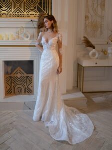 Beaded fit and flare wedding dress with long sleeves