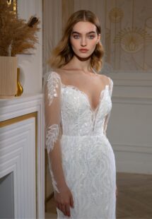 Style #2407L, beaded fit and flare wedding dress with long sleeves; available in ivory