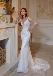 Style #2407L, beaded fit and flare wedding dress with long sleeves; available in ivory
