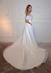 Style #2408L, organza off-the-shoulder A-line wedding dress with a slit; available in ivory