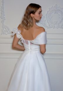 Style #2408L, organza off-the-shoulder A-line wedding dress with a slit; available in ivory