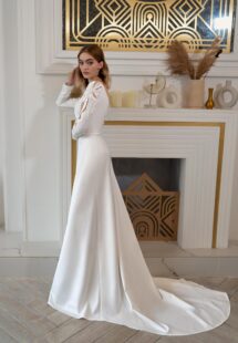 Style #2411L, plain wedding dress with long sleeves and open back; available in ivory