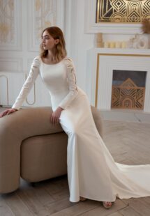 Style #2411L, plain wedding dress with long sleeves and open back; available in ivory