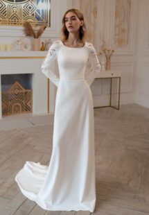 Style #2411L, plain wedding dress with long sleeves and open back; available in ivory