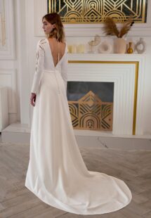 Style #2411L, plain wedding dress with long sleeves and open back; available in ivory