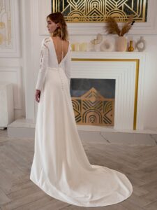 Plain wedding dress with long sleeves and open back
