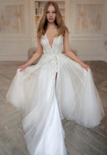 Style #2414L, V-neck A-line wedding dress with a slit; available in ivory