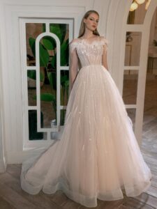 Illusion-neck ball gown wedding dress with sequins, feathers and beads; available in ivory-peach