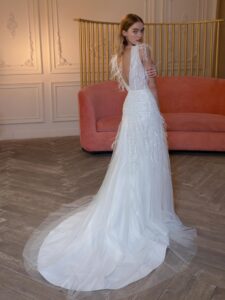 V-neck wedding dress with beads, feathers, and open back