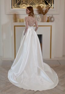Style #2420L, Mikado A-line wedding dress with long beaded sleeves and bow decor; available in ivory