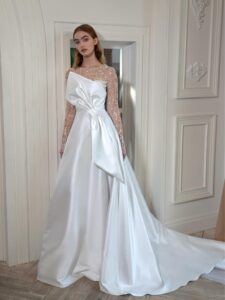 Mikado A-line wedding dress with long beaded sleeves and bow decor