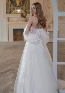 Style #2421L, A-line wedding dress with off-the-shoulder straps and floral embroidery; available in ivory-pink