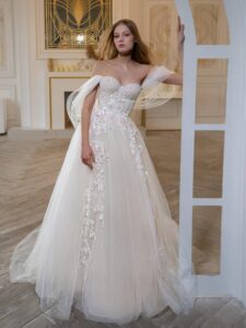 A-line wedding dress with off-the-shoulder straps and floral embroidery; available in ivory-pink