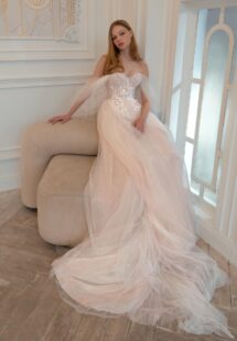 Style #2421L, A-line wedding dress with off-the-shoulder straps and floral embroidery; available in ivory-pink