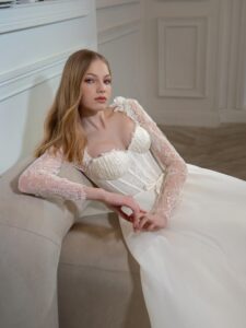 Organza A-line wedding dress with lace bustier style corset and long sleeves