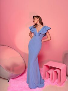 Style #808, V-neck fitted gala gown with flounce straps and open V-back; available in blue (shown online), dark blue, ivory, red, black, green, powder, grey, white
