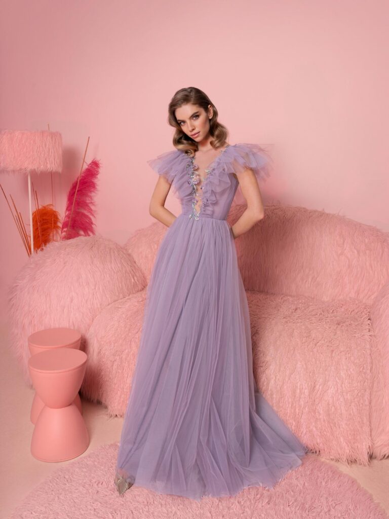Style #810, A-line evening dress with ruffled plunging neckline and open V-back; available in purple (shown online), ivory, grey-blue, black, cherry, powder, pink
