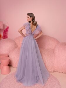 Style #810, A-line evening dress with ruffled plunging neckline and open V-back; available in purple (shown online), ivory, grey-blue, black, cherry, powder, pink