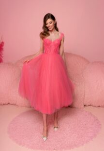 Style #817, tulle A-line dress with a bustier-style bodice and tulle straps; available in midi or floor length; in watermelon (shown online), light green, purple, ivory, pink, black, cherry, grey-blue, azure, powder